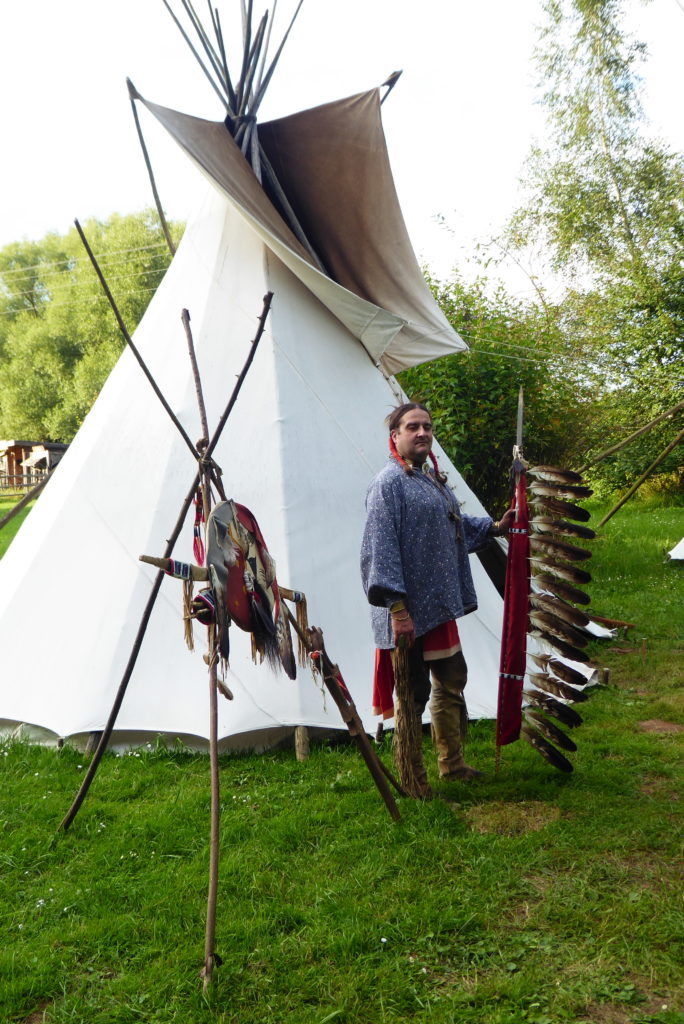 Authentic Camp 2021 - Lakota reenactor in front of teepee