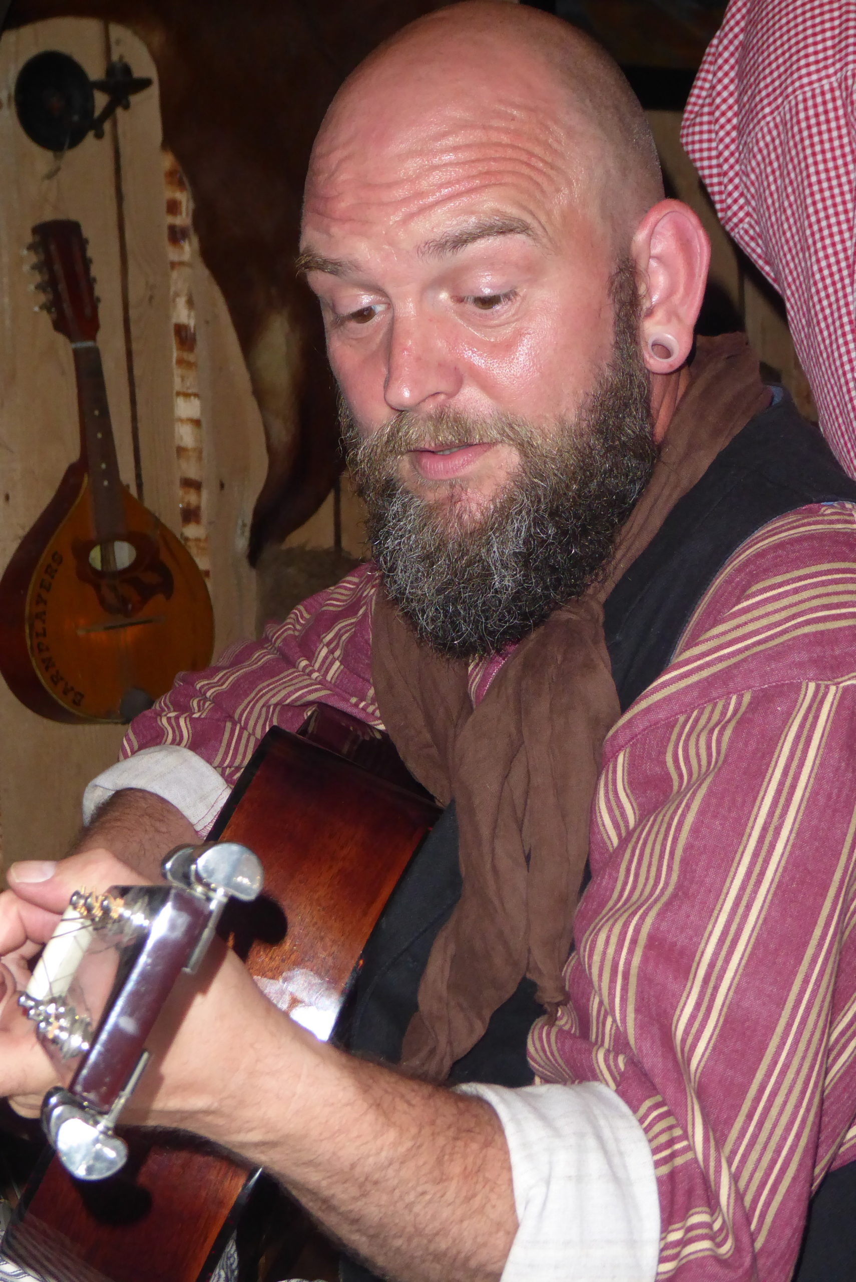 Authentic Camp 2021 - Bearded cowboy playing guitar